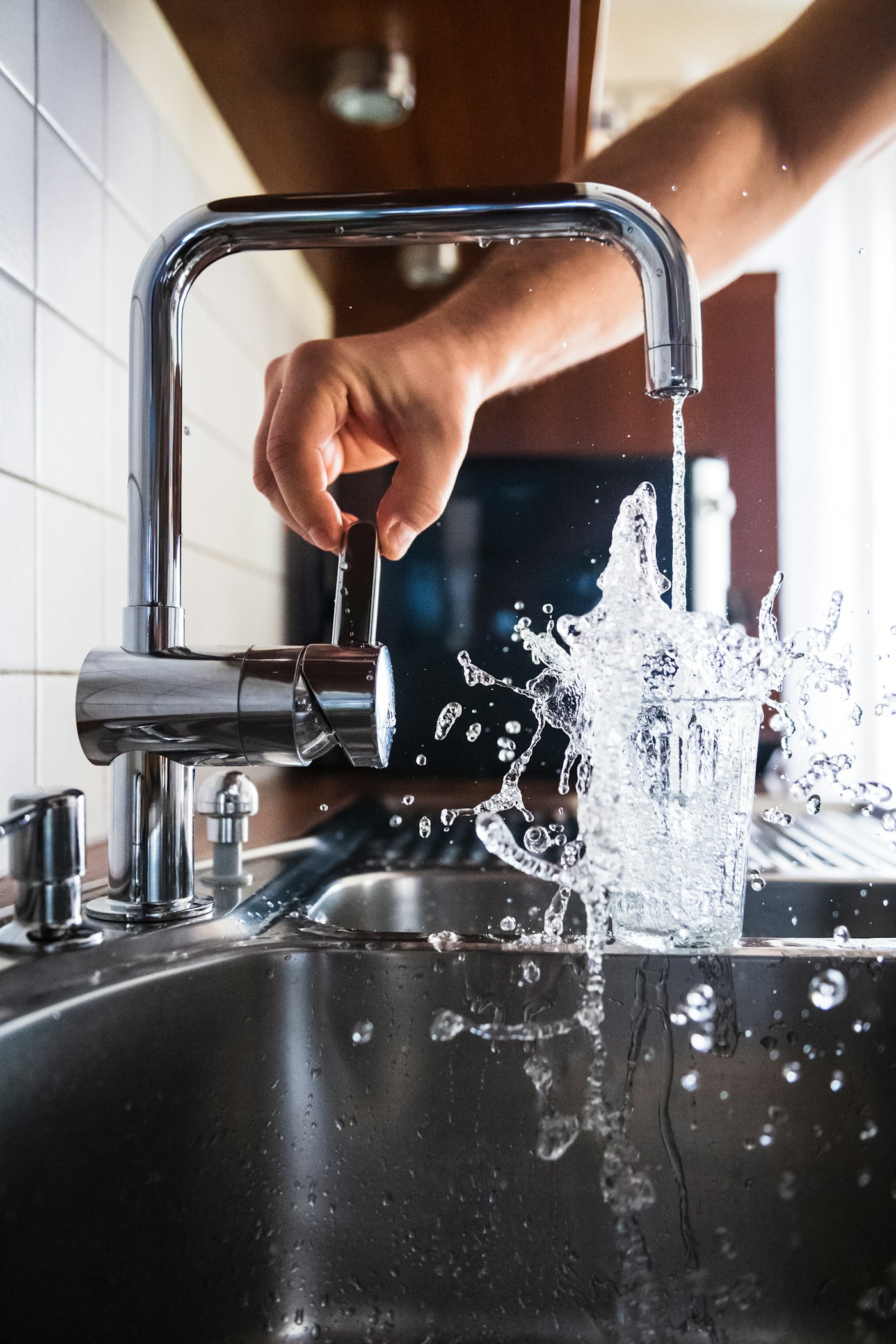 Fresh water pouring from a modern tap